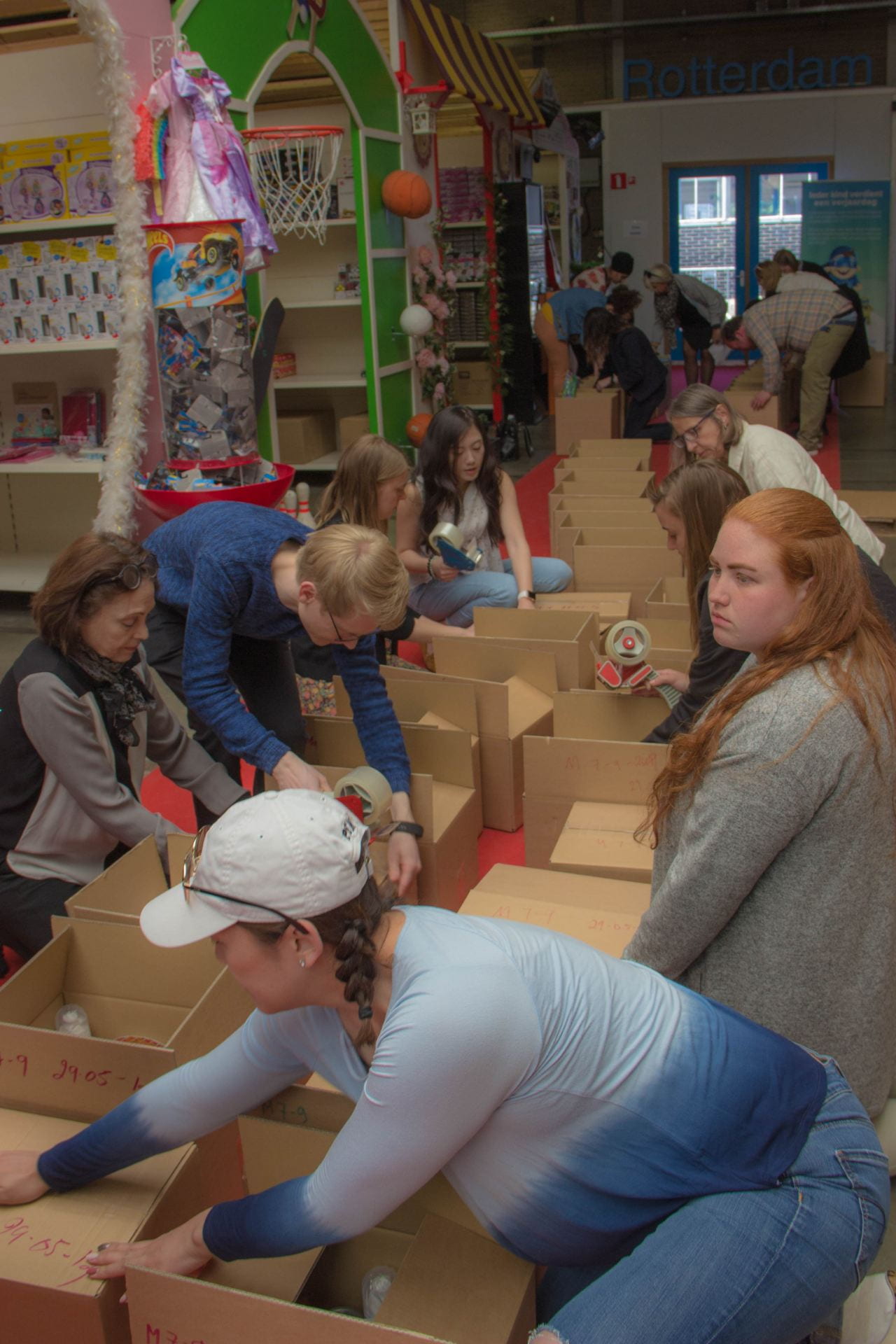 Students and leaders help pack birthday boxes. 