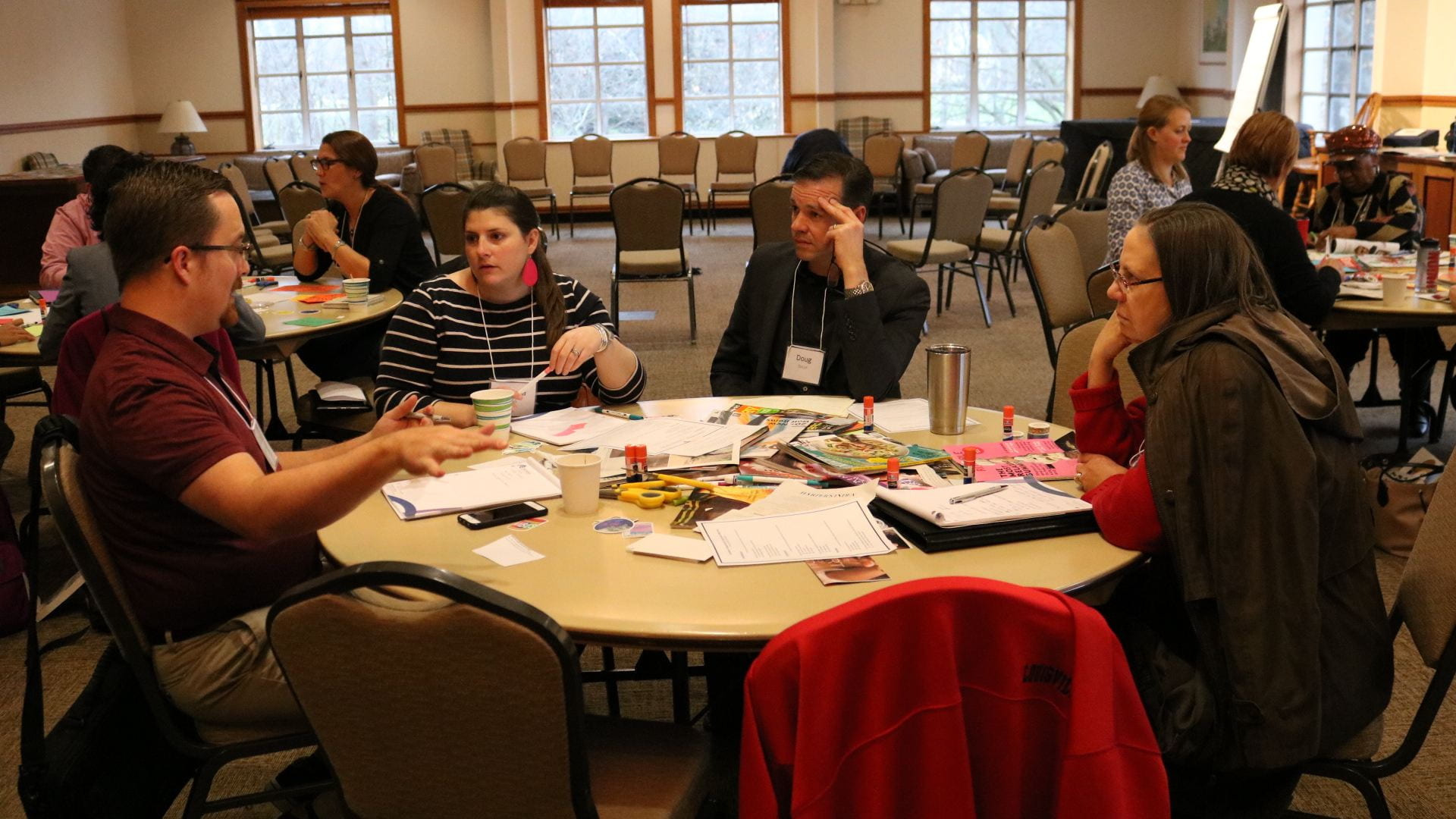 Participants discuss workshop materials. 