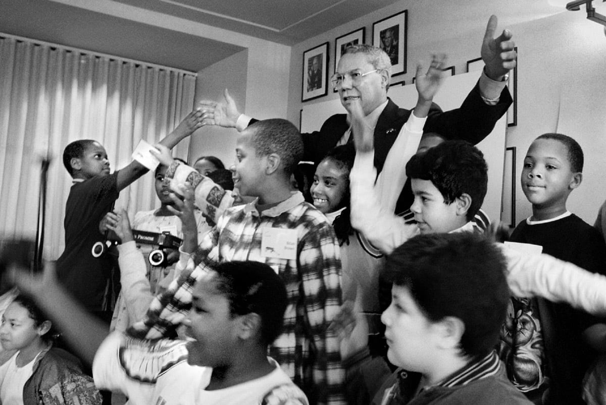 Colin Powell with group of children