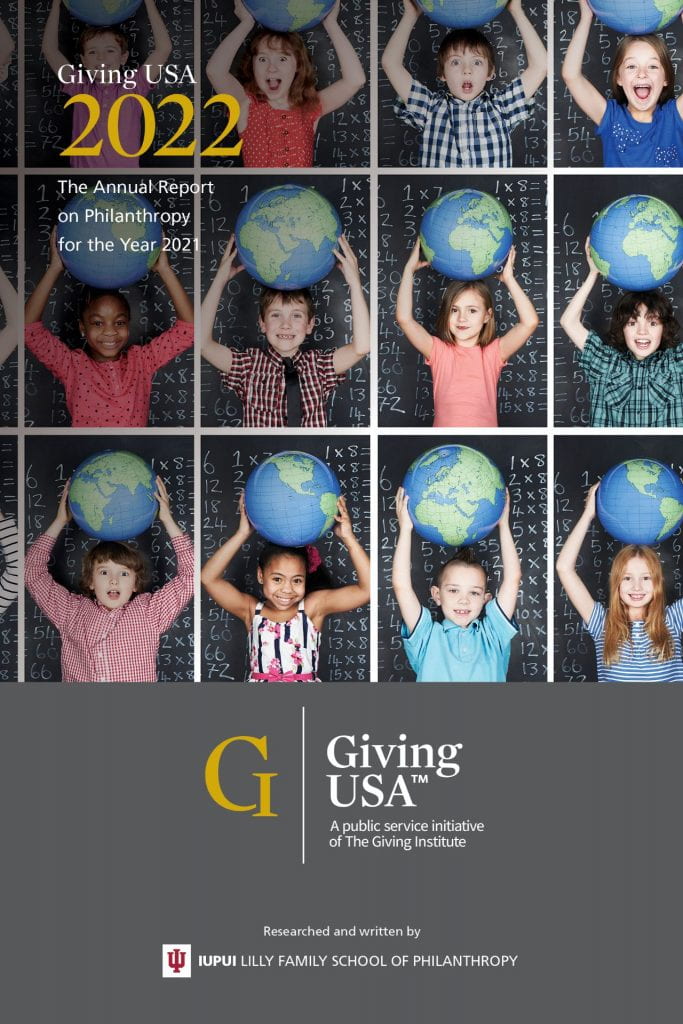 Graphic shows children holding globes from the middle to top of the image. Text reads: Giving USA 2022. The Annual Report on Philanthropy for the Year 2021. Researched and written by IUPUI Lilly Family School of Philanthropy.